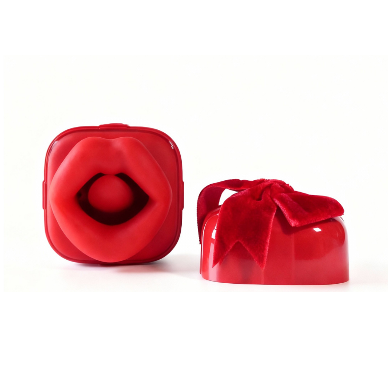 Extreme close-up, side-view of the opened gift box stimulator, clearly showing the central suction opening and the soft, flickering tongue for a dual-stimulation experience.