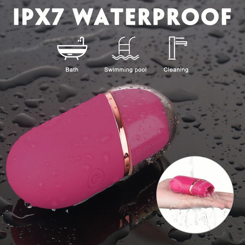 The IPX7 waterproof lipstick tongue licker on a wet surface, safe for use in the bath, swimming pool, and for effortless cleaning under running water.